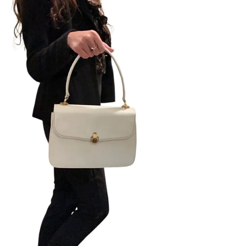 Gucci lizard embossed leather top handle tote